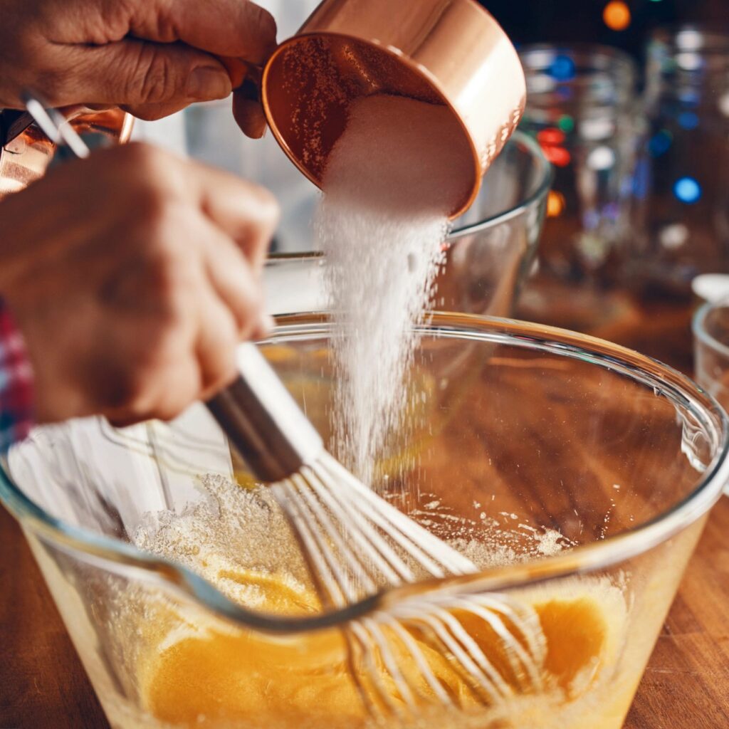Preparing Eggnog with Cinnamon for Christmas