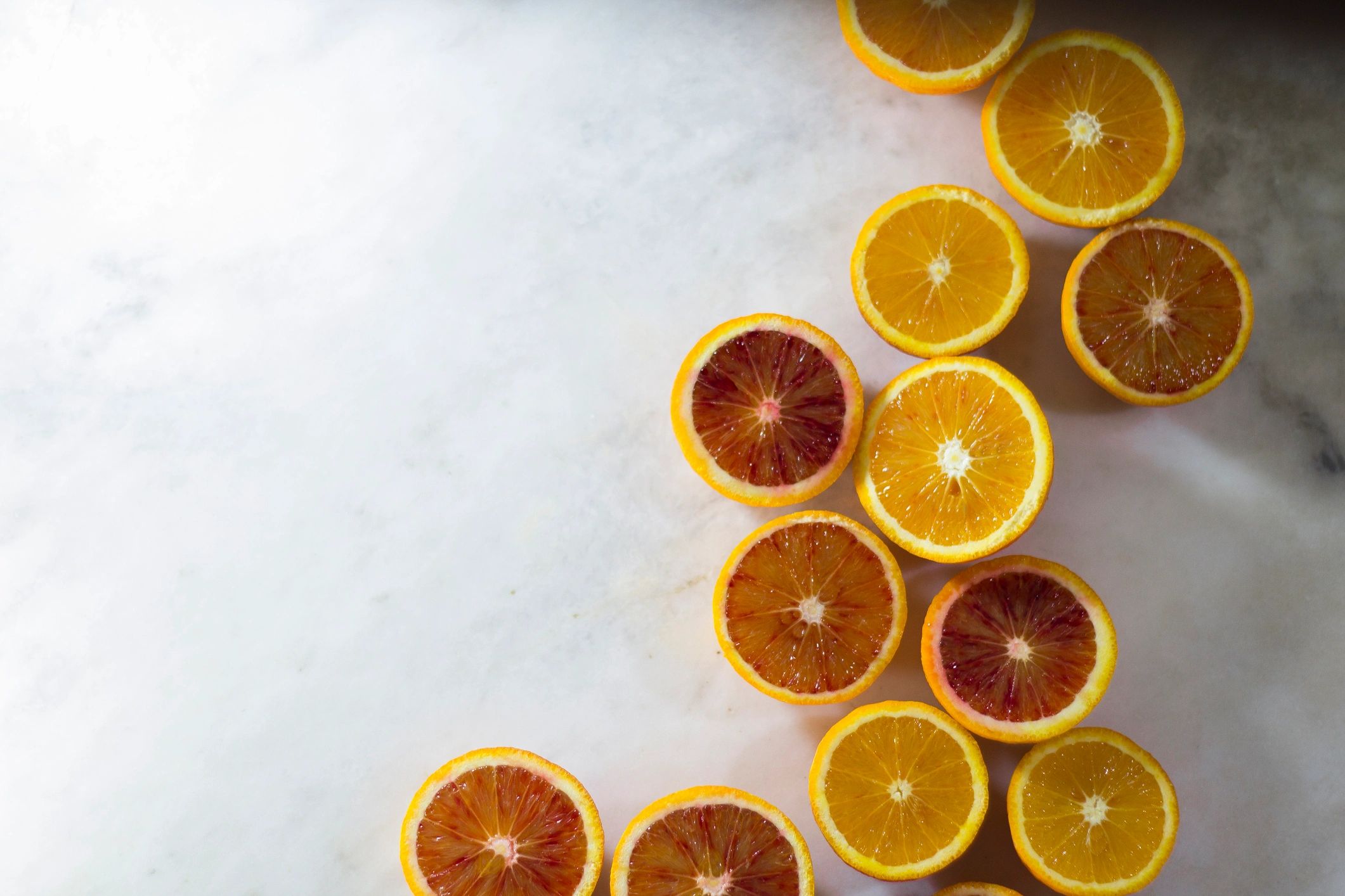 Fresh oranges arranged on a white background