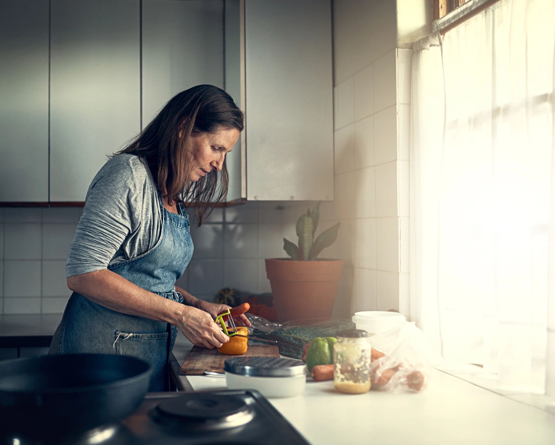 Home cook preparing a meal in her kitchen